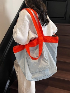 Fashionable grey and orange tote bag with large capacity for commuting and daily use