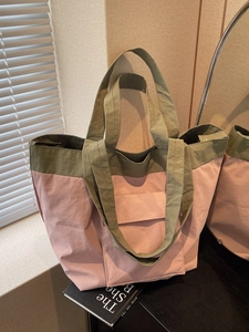 Fashionable large capacity tote bag with green and pink color block design for daily commute