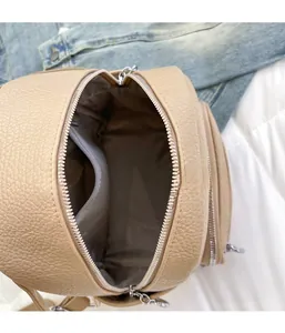 Top view of vintage soft leather backpack showing zipper closure and spacious interior