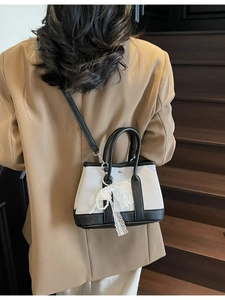 Minimalist canvas and black leather crossbody bag with decorative lace pearl bow