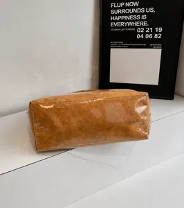 Detail view of reinforced brown leather base with transparent waterproof PVC coating