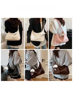 Hobo bag collection in multiple colors shown on model with plush cloud charm detail