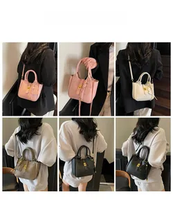 Detailed views of crossbody bucket bag with litchi texture and cute bear pendant
