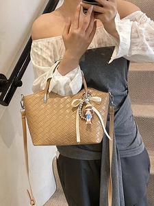 Khaki woven bucket bag with cute doll pendant and adjustable strap for women