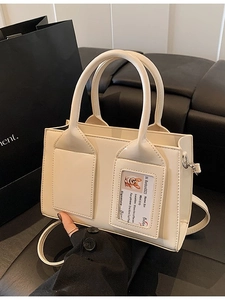 Chic cream white leather bucket handbag with transparent card slot and shoulder strap
