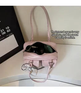 Interior view of pink leather shoulder bag showing spacious storage for daily essentials
