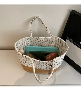 Large woven tote bag with straw base showing spacious interior for tablets and journals