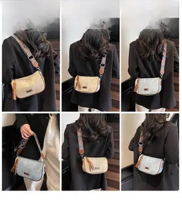 Detailed views of vintage pillow bag with ethnic floral strap and long leather zipper