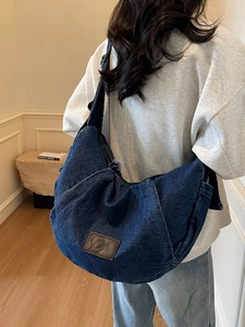 Deep blue denim crossbody hobo bag for women with wash finish and leather patch