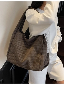 Deep brown plaid large capacity shoulder tote bag shown on model in minimalist setting