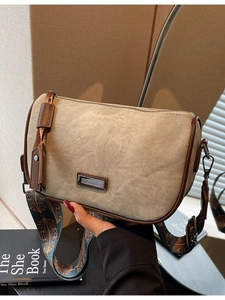 Retro canvas pillow bag with brown leather trim and ethnic style woven strap