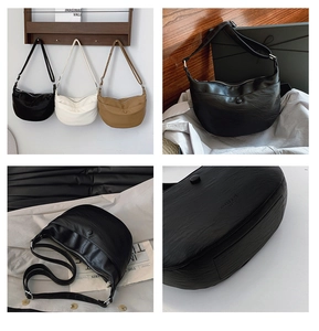 Detailed view of three hobo shoulder bags in black beige and khaki textured faux leather