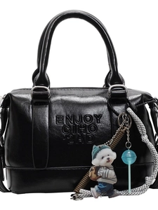 Minimalist black Boston handbag with leather texture and decorative strap for women