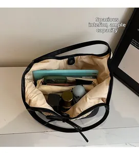 Top view of spacious woven tote bag interior showing large capacity for tablet and items