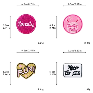 Detail view of pink glitter heart and circle embroidery patches with precise measurements
