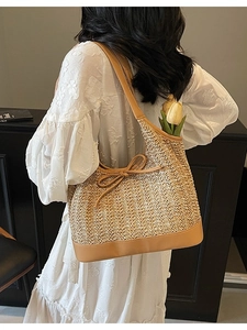 Chic striped woven tote bag with brown leather straps and yellow tulip decoration