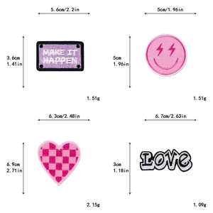 Detail view of pink glitter heart and smiley patches with precise size and weight markers