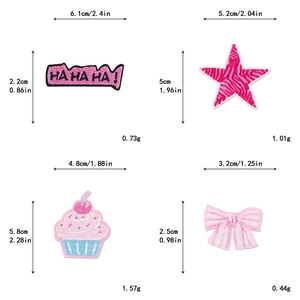 Macro shot of glittery pink embroidery patches with detailed stitches and size measurements