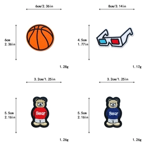 Detail view of sports bear embroidery patches with precise size and weight measurements