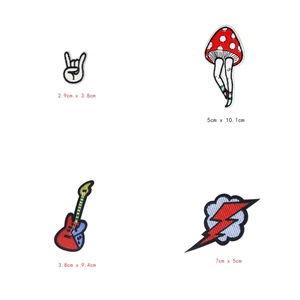 Close-up of four embroidered patches including mushroom and guitar with detailed sizes