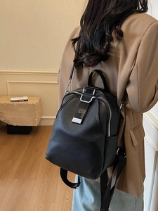 Fashionable black pebbled leather backpack for women featuring stylish silver metal buckle