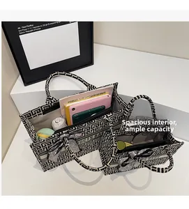 Top view of large canvas tote bag showing spacious interior with tablet and daily items
