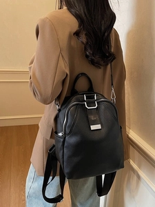 Classic black pebbled leather backpack for women with silver hardware and adjustable straps