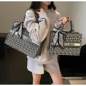 Detailed comparison of large and small canvas tote bags with geometric patterns and silk scarves