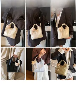 Detail view of stylish tote bags in four colors with bear charms and adjustable straps