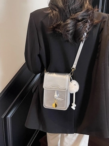 Silver leather mini crossbody phone bag with gold charm and white pompom detail
