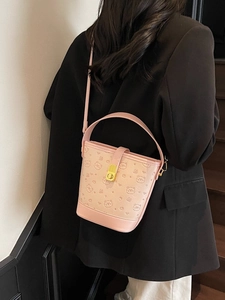Stylish light pink bucket bag with cartoon bear prints and golden metal buckle for women