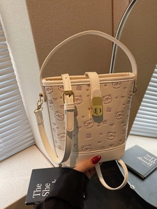 Chic beige bucket bag with bear embossed pattern and vintage gold metal clasp lock