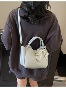 Light blue lychee pattern bucket bag with pearl lace bow and gold hardware detail