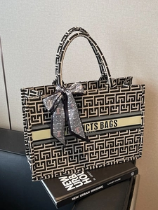 Chic canvas tote bag with geometric maze pattern and elegant silk scarf decoration
