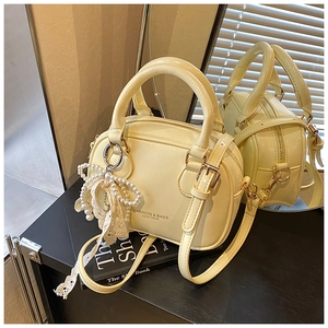 Light yellow PU leather Boston bag with pearl bow charm and adjustable strap