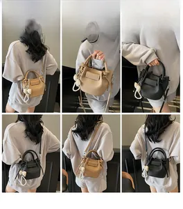 French style pleated bucket bag shown in multiple poses by a model for styling