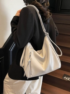 Minimalist large white leather tote bag for women featuring multiple thin shoulder straps