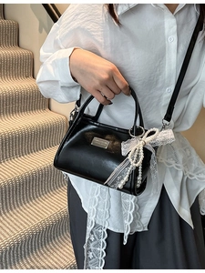 Elegant black glossy bow underarm bag with pearl lace pendant and silver metal plaque