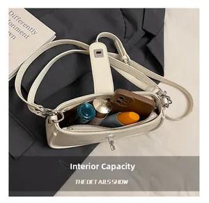 Top view showing large interior capacity of cream leather hobo bag with daily essentials