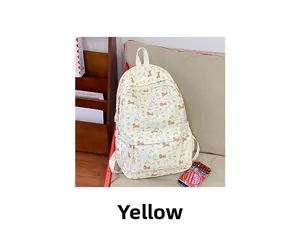 Detail of canvas backpack featuring cute cartoon dog prints and front zipper pocket