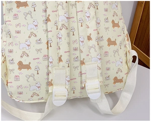 Detail of adjustable straps and canvas texture on the cute cartoon dog print backpack