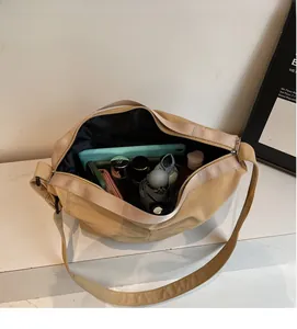 Detailed interior of the beige tote bag showing large capacity for tablet and umbrella