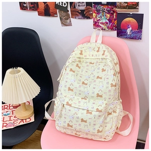 Detail view of cartoon dog print backpack with large capacity and multi-pocket design