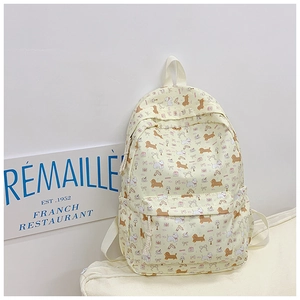 Detail showing cute puppy and gift prints on light yellow school backpack for students