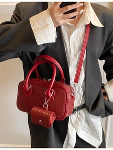 Retro red woven leather bowling bag with matching mini charm and shoulder strap