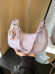 Lavender faux leather half-moon shoulder bag with a cute charm and top handle strap