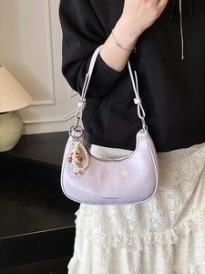 Chic lavender crescent shoulder bag with fashion prints and a pearl doll charm