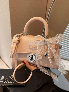 Pink faux leather crossbody bag with lace bow, pearl chain and silver heart pendant