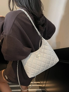 White quilted faux leather crossbody bag with silver chain strap and metal turn lock