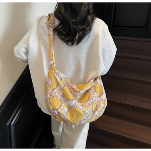 Detail of sunflower print canvas bag showing the adjustable strap and large capacity